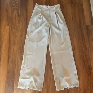 Beige wide leg trouser with a slip at the bottom